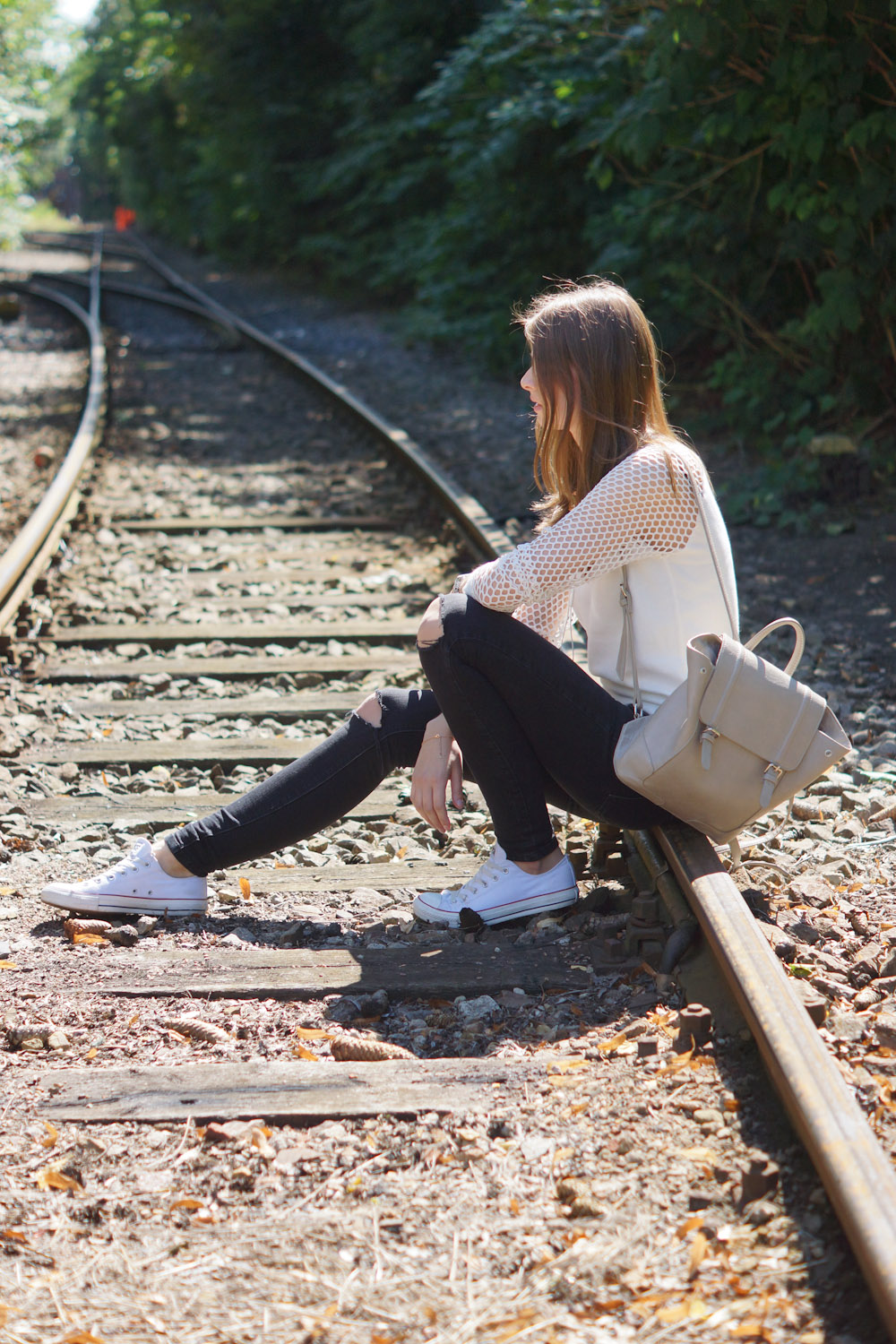 Railroad Tracks - Frends Headphones and white sweater