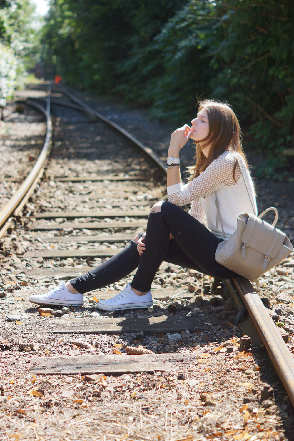 Railroad Tracks - Frends Headphones and white sweater