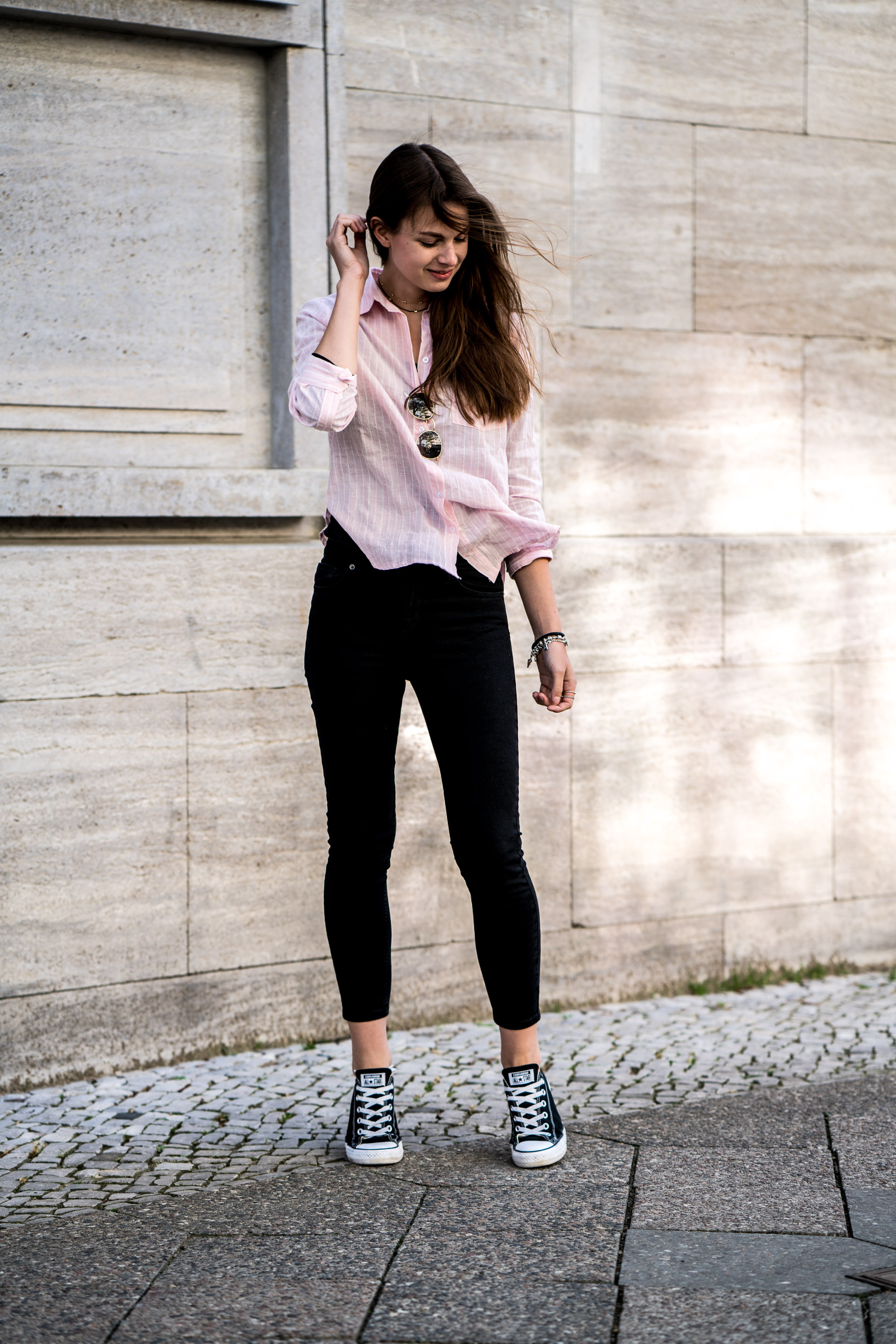 Black jeans and pink shirt on sale