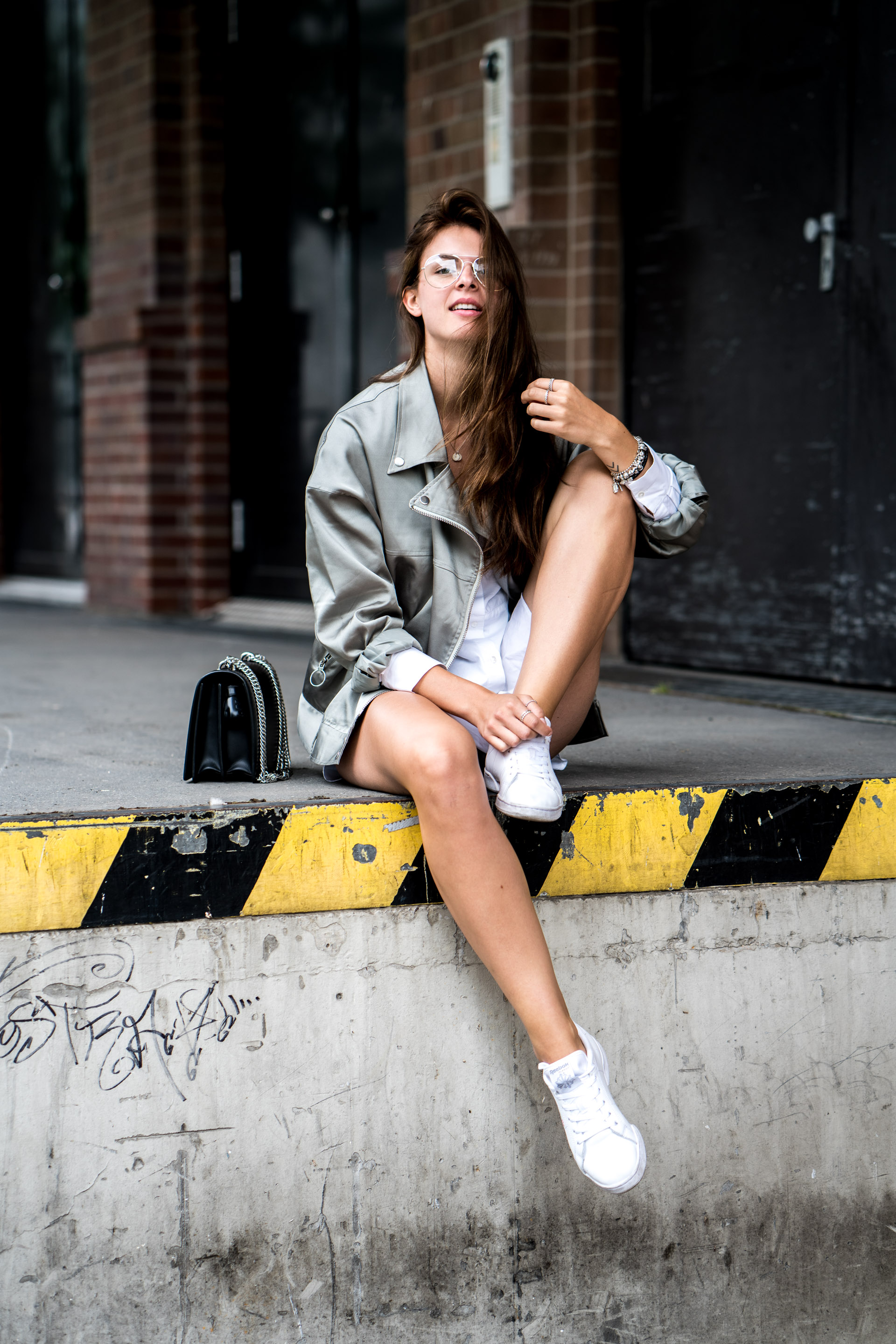 How to combine a white shirt dress and a bomber jacket