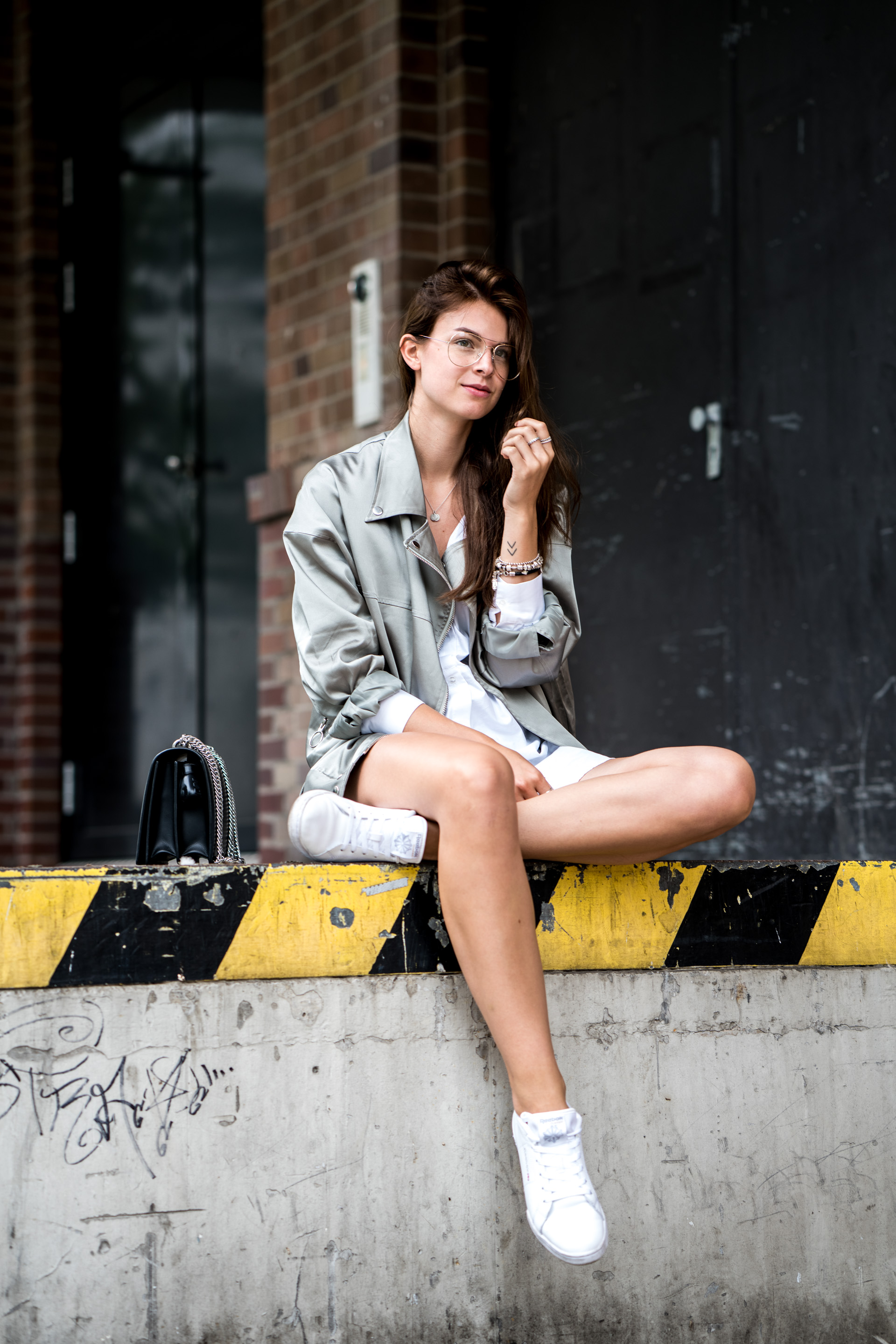 How to combine a white shirt dress and a bomber jacket