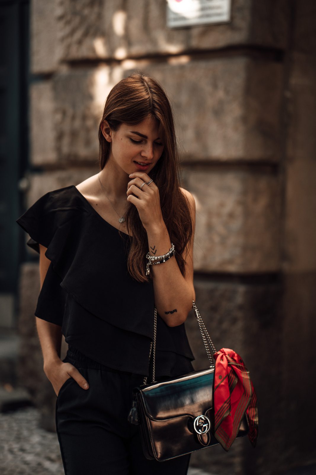 Combining an asymmetric one shoulder shirt with an all black look